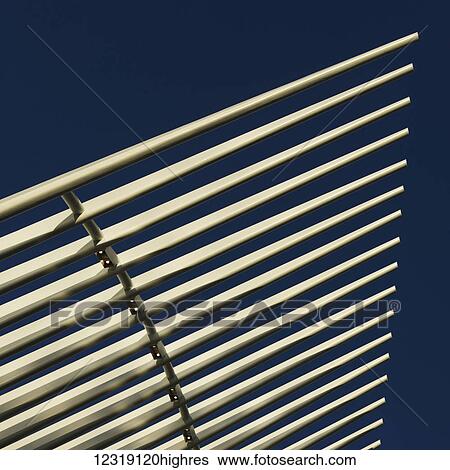 Stock Photograph - Structure with white prongs in a row against a blue sky; New York City, New York, United States of America. Fotosearch