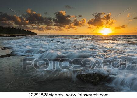Sunrise and surf on the east coast of Kauai; Kauai, Hawaii, United States of America View Large Photo Image Stock Photograph - Sunrise and surf on the east coast of Kauai; Kauai, Hawaii, United States of America. Fotosearch