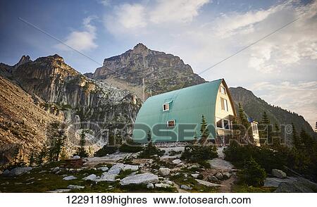 Stock Photograph - Sunrise at the Alpine Club of Conrad Kain Hut in the Bugaboos Provincial Park; British Columbia, Canada. Fotosearch
