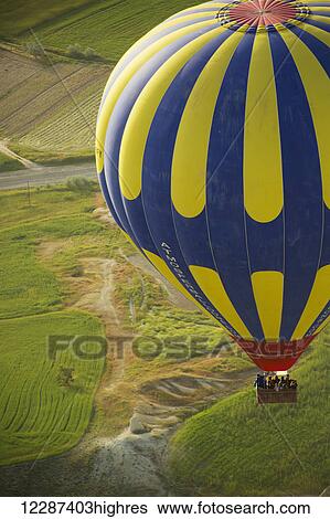 Stock Photograph - Sunrise balloon ride over Goreme National Park; Cappadocia, Turkey. Fotosearch