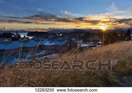 Stock Image - Sunrise over Providence Kodiak Island Medical Center (PKIMC), Kodiak Island, Southwest Alaska, Autumn. Fotosearch