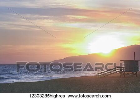 Stock Photograph - Sunset at Zuma Beach; Malibu, California, USA. Fotosearch
