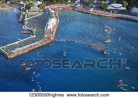 Stock Photograph - Swimmers ready for start of Ironman Triathlon World Championship; Kailua-Kona, Island of Hawaii, Hawaii, United States of America. Fotosearch