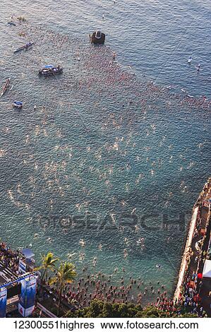Swimmers ready for start of Ironman Triathlon World Championship; Kailua-Kona, Island of Hawaii, Hawaii, United States of America View Large Photo Image Stock Photograph - Swimmers ready for start of Ironman Triathlon World Championship; Kailua-Kona, Island of Hawaii, Hawaii, United States of America. Fotosearch