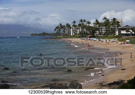 Swimmers, stand up paddle boarders, sun bathers, condo or hotel, Kamaole I Beach Park; Kihei, Maui, Hawaii, United States of America View Large Photo Image Stock Photograph - Swimmers, stand up paddle boarders, sun bathers, condo or hotel, Kamaole I Beach Park; Kihei, Maui, Hawaii, United States of America. Fotosearch