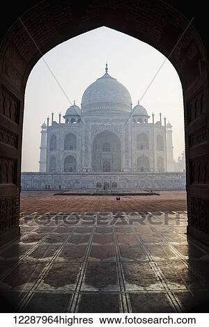 Stock Photograph - Taj Mahal framed in mosque arch; Agra, Uttar Pradesh, India. Fotosearch