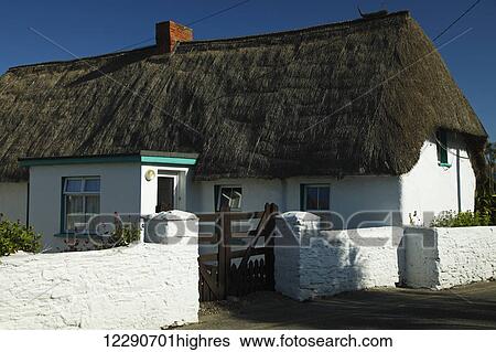 Stock Photograph - Thatch cottage in Kilmore Quay village; County Wexford, Ireland. Fotosearch