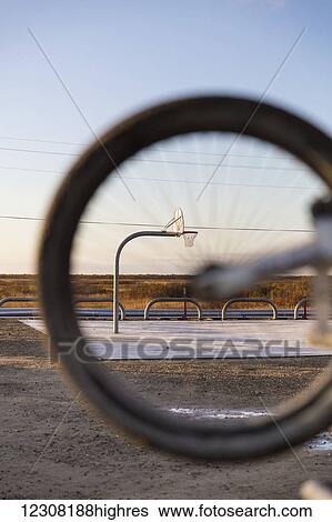 The Alakanuk Public School Basketball Court as seen through the wheel of a bicycle, Alakanuk, Yukon Delta, Arctic Alaska, USA, Fall View Large Photo Image Stock Photograph - The Alakanuk Public School Basketball Court as seen through the wheel of a bicycle, Alakanuk, Yukon Delta, Arctic Alaska, USA, Fall. Fotosearch