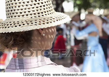 The back of a woman's head wearing a sunhat as she watches a couple dancing; Havana, Cuba View Large Photo Image Stock Photograph - The back of a woman's head wearing a sunhat as she watches a couple dancing; Havana, Cuba. Fotosearch