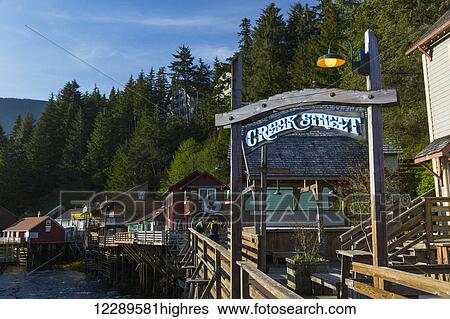 Stock Photograph - The Creek Street sign and boardwalk, downtown Ketchikan, Southeast Alaska, USA, Spring. Fotosearch