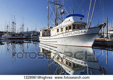 The Fishing Boat LadyLinda moored in the Sitka Harbor is reflected in calm waters on a clear day, Sitka, Southeast Alaska, USA, Summer View Large Photo Image Stock Photograph - The Fishing Boat LadyLinda moored in the Sitka Harbor is reflected in calm waters on a clear day, Sitka, Southeast Alaska, USA, Summer. Fotosearch