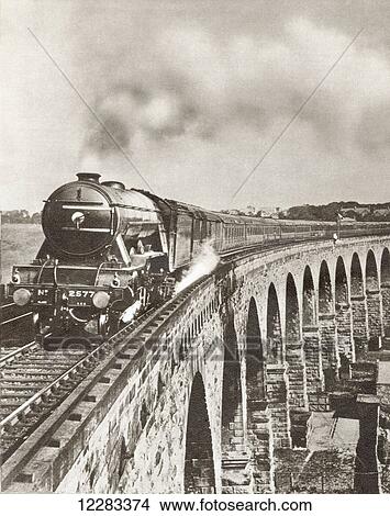 The Flying Scotsman on it's non-stop journey between London and Newcastle in 1927. From The Story of 25 Eventful Years in Pictures, published 1935. View Large Photo Image Picture - The Flying Scotsman on it's non-stop journey between London and Newcastle in 1927. From The Story of 25 Eventful Years in Pictures, published 1935.. Fotosearch