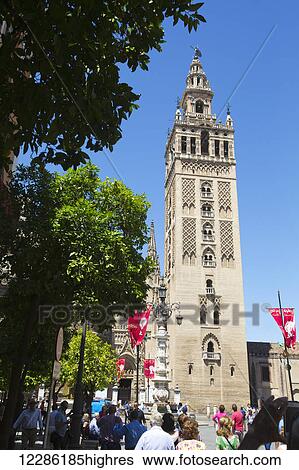 Stock Photograph - The Giralda bell tower, part of the Seville Cathedral; Seville, Spain. Fotosearch