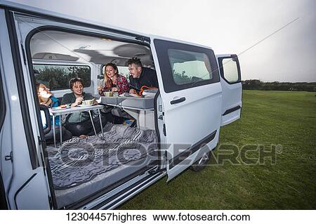 The inside of a campervan becomes a work station and living room; Penzance, England View Large Photo Image Stock Photograph - The inside of a campervan becomes a work station and living room; Penzance, England. Fotosearch