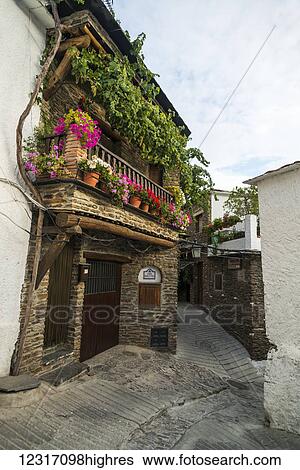 The locals decorate their balconies with colourful flowers, Alpujarra; Pampaneira, Granada Province, Andalucia, Spain View Large Photo Image Stock Photograph - The locals decorate their balconies with colourful flowers, Alpujarra; Pampaneira, Granada Province, Andalucia, Spain. Fotosearch