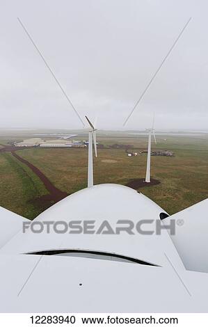 Stock Image - The nose cone of a rotor of a wind turbine as viewed from atop the Nacelle wind turbine, St. Paul Island, Southwestern Alaska, USA, Summer . Fotosearch