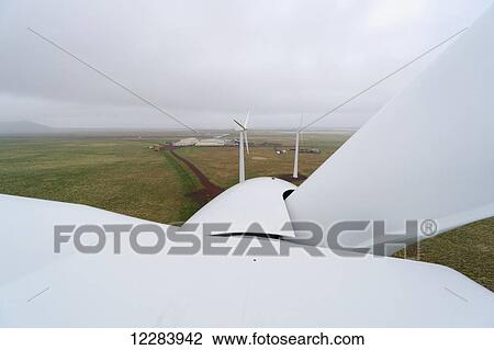 Stock Image - The nose cone of a rotor of a wind turbine as viewed from atop the Nacelle wind turbine, St. Paul Island, Southwestern Alaska, USA, Summer . Fotosearch