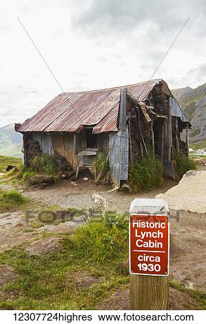 Stock Photograph - The old historic Lynch Cabin on the trail to Gold Cord Lake in Hatcher Pass, Alaska in Summer. Southcentral Alaska.. Fotosearch