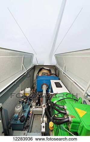 The open side of a wind turbine with the low speed shaft, gear box, and generator visible, St. Paul Island, Southwestern Alaska, USA, Summer View Large Photo Image Stock Photograph - The open side of a wind turbine with the low speed shaft, gear box, and generator visible, St. Paul Island, Southwestern Alaska, USA, Summer . Fotosearch