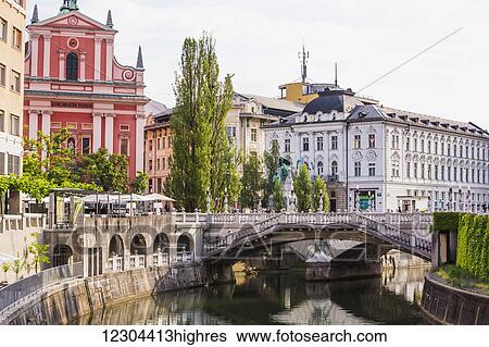 The Slovenian capital city of Ljubljana, with a footbridge over a tranquil canal; Ljubljana, Slovenia View Large Photo Image Stock Photograph - The Slovenian capital city of Ljubljana, with a footbridge over a tranquil canal; Ljubljana, Slovenia. Fotosearch