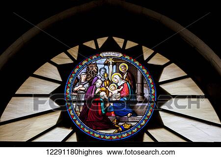Stock Photograph - The stained glass at the exit of the Church of St. Catherine that is attached to the Church of the Nativity; Bethlehem, Israel. Fotosearch