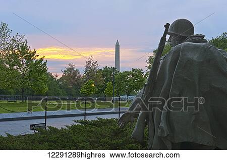 The statue of a soldier looks to the side at the Korean War Veterans Memorial in Washington, D. C. with the Washington Monument in the background; Washington, District of Columbia, United States of America View Large Photo Image Stock Photograph - The statue of a soldier looks to the side at the Korean War Veterans Memorial in Washington, D. C. with the Washington Monument in the background; Washington, District of Columbia, United States of America. Fotosearch