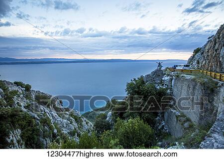Stock Photograph - The stunning high altitude cliffside roads along the coastline of Croatia; Podgora, Croatia. Fotosearch