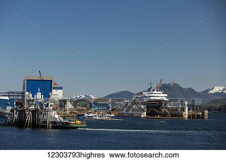 Stock Photograph - The Taku passenger ferry docked in the Ketchikan shipyard for repairs, Southeast Alaska, USA, spring. Fotosearch