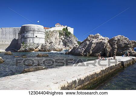 The Walls of Dubrovnik surround the old city of Dubrovnik and provide stunning scenery and vantage points around the city; Dubrovnik, Croatia View Large Photo Image Stock Photograph - The Walls of Dubrovnik surround the old city of Dubrovnik and provide stunning scenery and vantage points around the city; Dubrovnik, Croatia. Fotosearch