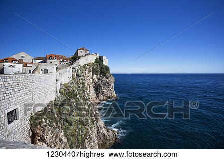 Stock Photograph - The Walls of Dubrovnik surround the old city of Dubrovnik and provide stunning scenery and vantage points around the city; Dubrovnik, Croatia. Fotosearch