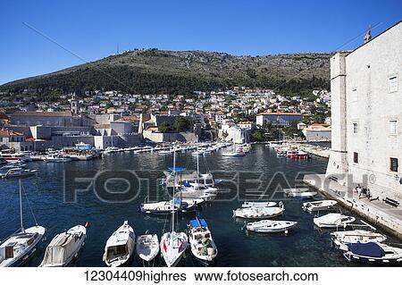 Stock Photograph - The Walls of Dubrovnik surround the old city of Dubrovnik and provide stunning scenery and vantage points around the city; Dubrovnik, Croatia. Fotosearch