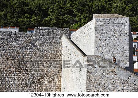 The Walls of Dubrovnik surround the old city of Dubrovnik and provide stunning scenery and vantage points around the city; Dubrovnik, Croatia View Large Photo Image Stock Photograph - The Walls of Dubrovnik surround the old city of Dubrovnik and provide stunning scenery and vantage points around the city; Dubrovnik, Croatia. Fotosearch