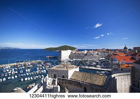 Stock Photograph - The Walls of Dubrovnik surround the old city of Dubrovnik and provide stunning scenery and vantage points around the city; Dubrovnik, Croatia. Fotosearch