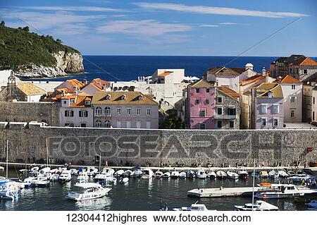 The Walls of Dubrovnik surround the old city of Dubrovnik and provide stunning scenery and vantage points around the city; Dubrovnik, Croatia View Large Photo Image Stock Photograph - The Walls of Dubrovnik surround the old city of Dubrovnik and provide stunning scenery and vantage points around the city; Dubrovnik, Croatia. Fotosearch