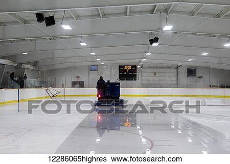 The zamboni driver melts the ice at an ice rink; Alberta, Canada View Large Photo Image Stock Photograph - The zamboni driver melts the ice at an ice rink; Alberta, Canada. Fotosearch