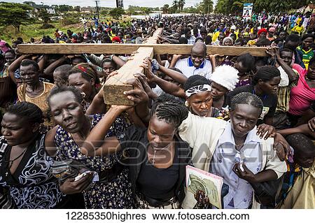 Thousands gather on Good Friday to walk through the streets and proclaim the Gift of God; Gulu, Uganda View Large Photo Image Stock Photograph - Thousands gather on Good Friday to walk through the streets and proclaim the Gift of God; Gulu, Uganda. Fotosearch