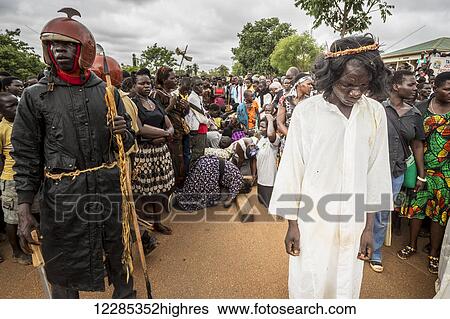 Stock Photograph - Thousands gather on Good Friday to walk through the streets and proclaim the Gift of God; Gulu, Uganda. Fotosearch
