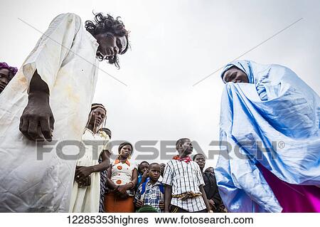 Thousands gather on Good Friday to walk through the streets and proclaim the Gift of God; Gulu, Uganda View Large Photo Image Stock Photograph - Thousands gather on Good Friday to walk through the streets and proclaim the Gift of God; Gulu, Uganda. Fotosearch