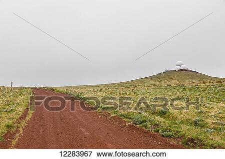 Three radar domes sit atop a green tundra hillside with a red dirt road in the foreground, St. Paul Island, Southwestern Alaska, USA, Summer View Large Photo Image Stock Photo - Three radar domes sit atop a green tundra hillside with a red dirt road in the foreground, St. Paul Island, Southwestern Alaska, USA, Summer. Fotosearch