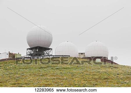 Three radar domes sit atop a green tundra hillside, St. Paul Island, Southwestern Alaska, USA, Summer View Large Photo Image Stock Photography - Three radar domes sit atop a green tundra hillside, St. Paul Island, Southwestern Alaska, USA, Summer . Fotosearch