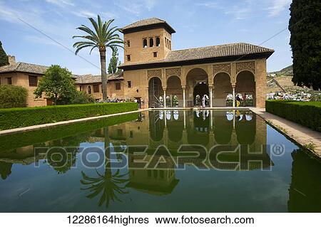 Stock Photograph - Torre de las Damas, Reflecting pool at the Alhambra Palace; Malaga, Spain. Fotosearch