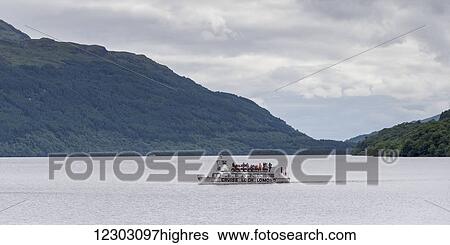 Stock Photograph - Tour boat on Loch Lomond; Arrochar, Scotland. Fotosearch