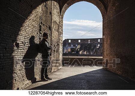 Stock Photograph - Tourist at Colosseum; Rome, Italy. Fotosearch