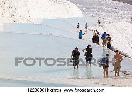 Tourist at the mineral rich pools and hot springs; Pamukkale, Turkey View Large Photo Image Stock Photograph - Tourist at the mineral rich pools and hot springs; Pamukkale, Turkey. Fotosearch