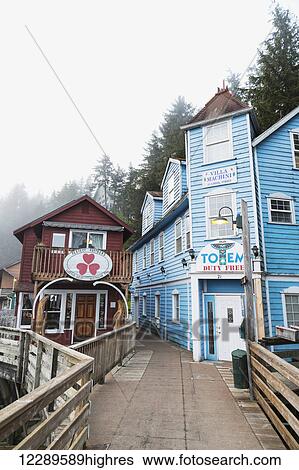 Stock Photograph - Tourist shops and homes along Creek Street in downtown Ketchikan, Southeast Alaska, USA, Spring. Fotosearch
