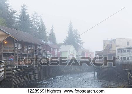 Stock Photograph - Tourist shops and homes along Creek Street in downtown Ketchikan, Southeast Alaska, USA, Spring. Fotosearch
