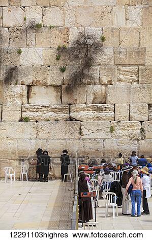 Stock Photograph - Tourists and Orthodox jews at the Wailing Wall; Jerusalem, Israel. Fotosearch
