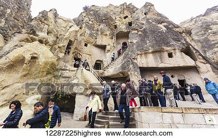 Stock Photograph - Tourists at Goreme National Park; Goreme, Cappadocia, Turkey. Fotosearch