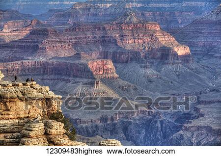 Stock Photograph - Tourists at Mather Point, early morning, South Rim, Grand Canyon National Park, UNESCO World Heritage Site; Arizona, United States of America. Fotosearch