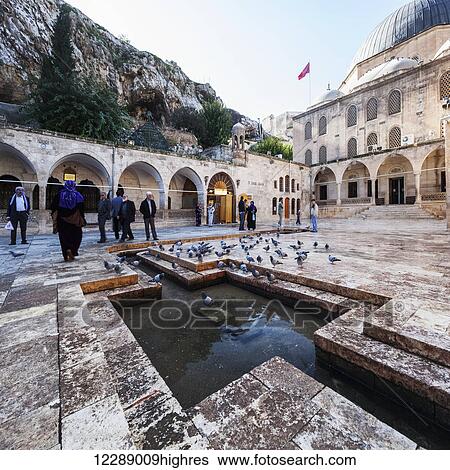 Stock Photograph - Tourists at the Chamber of Abraham; Sanliurfa, Turkey. Fotosearch
